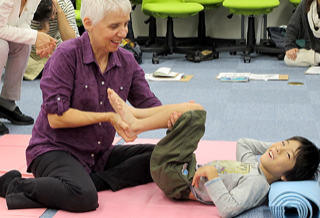 Cece Koester working with a child during a movement session
